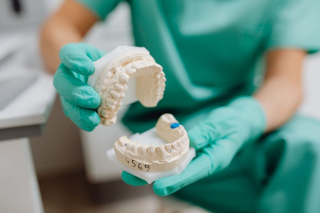 Hold the crown only &mdash; the root surface cells are what allow reattachment