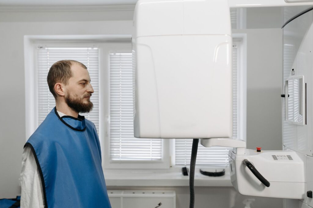 Scans are taken selectively, never routinely — the ALARA principle