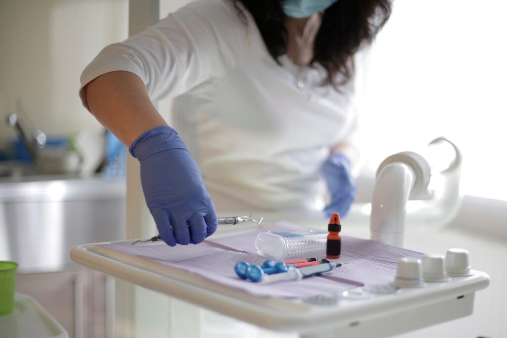 Between visits the canal usually holds an antimicrobial dressing